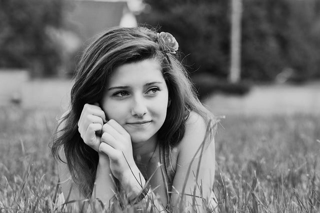 girl lying in field