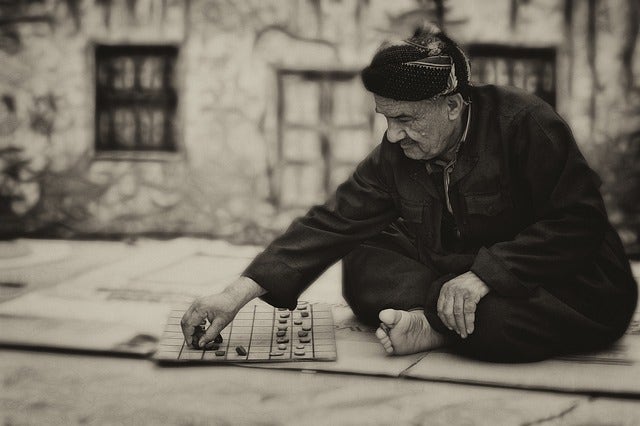 man on street playing game