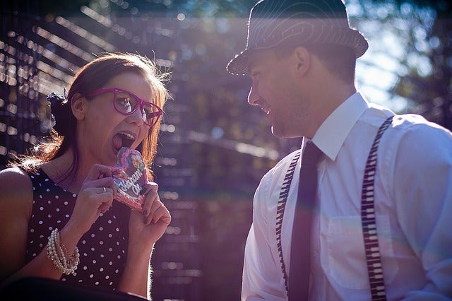 candid photo of girl eating candy