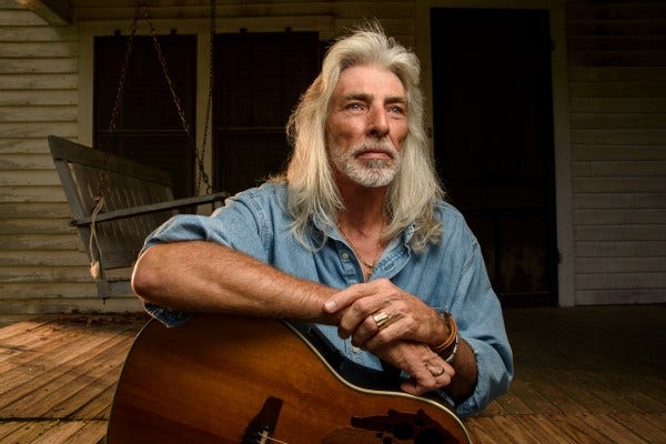 man playing guitar from joe mcnally blog
