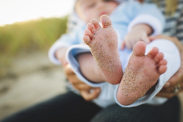 sand on a baby's feet