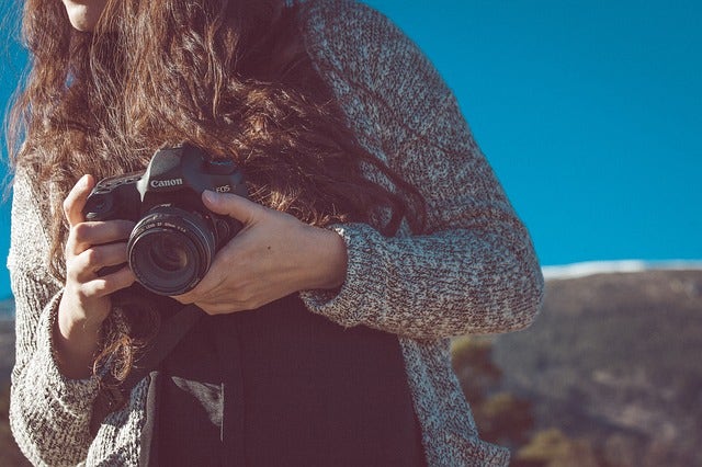 Woman with a DSLR