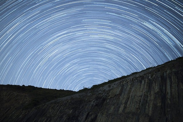 Stars captured during a long exposure showing light trails