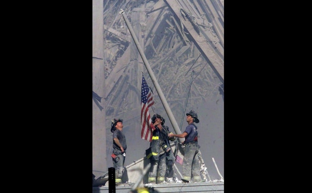 3-firemen-raise-flag-after-911