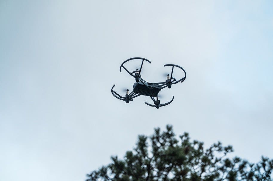 drone in air with drone guards