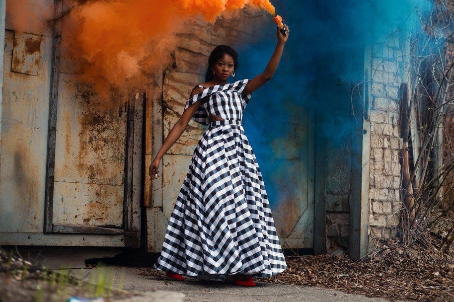 woman holding flare for fashion photograph