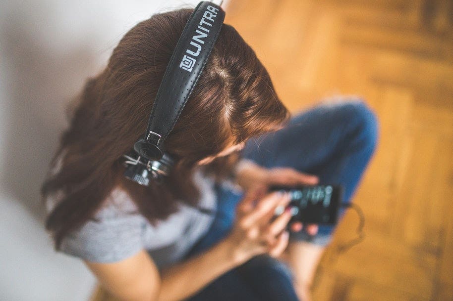 woman wearing headphone with camera