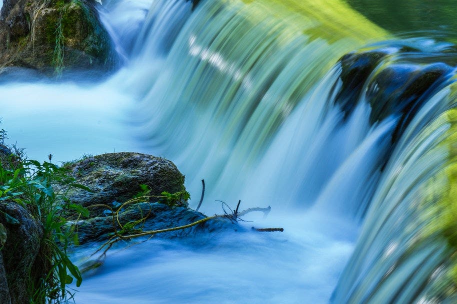 smooth flow of water in waterfall achieved with long shutter speed