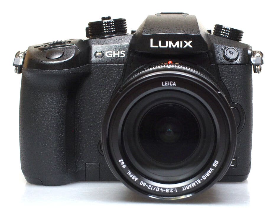 A Panasonic Lumix GH5 camera with lens and a mini-DSLR body design.