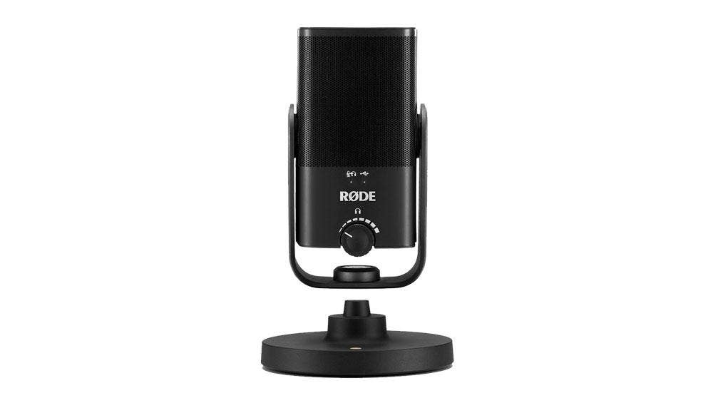 A Rode NT USB microphone on a desk tripod.