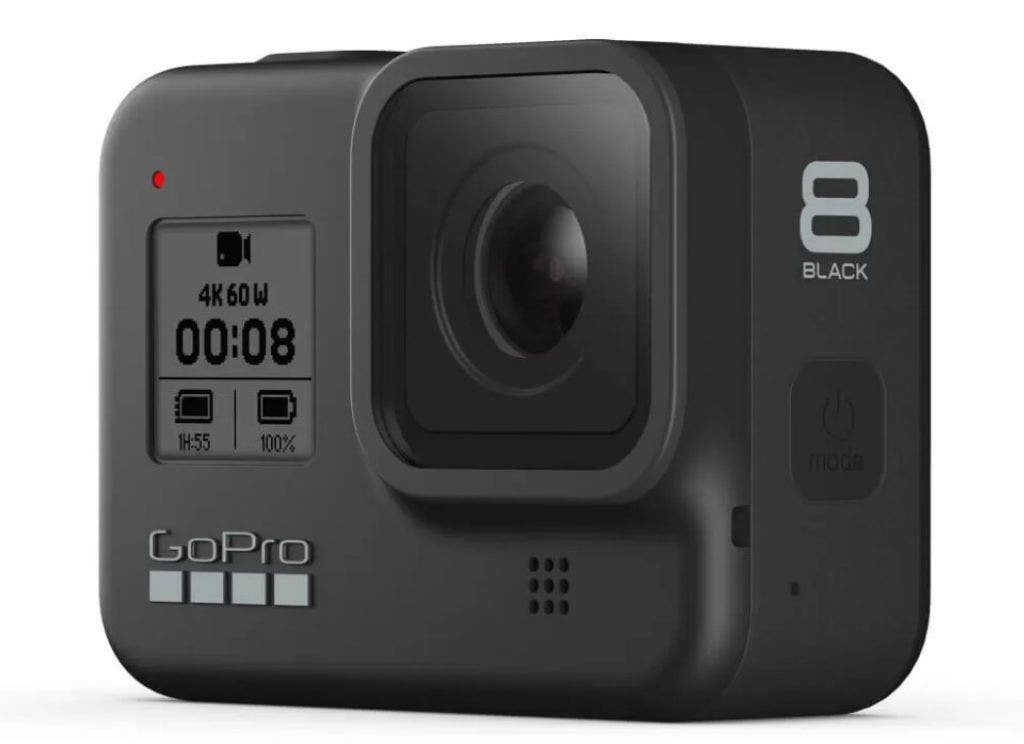 A view of the GoPro HERO8 action camera from the front with its large lens and black and white display