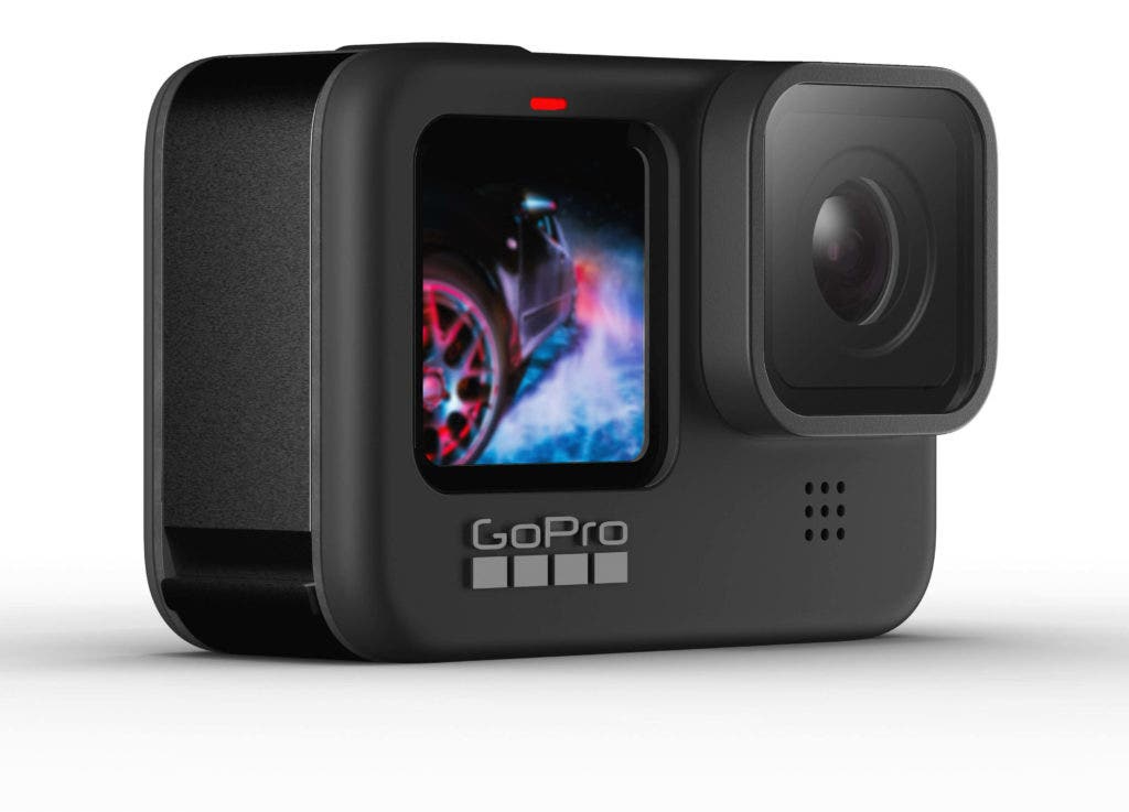 A GoPro HERO9 action camera with its large lens and colour live preview front screen. 