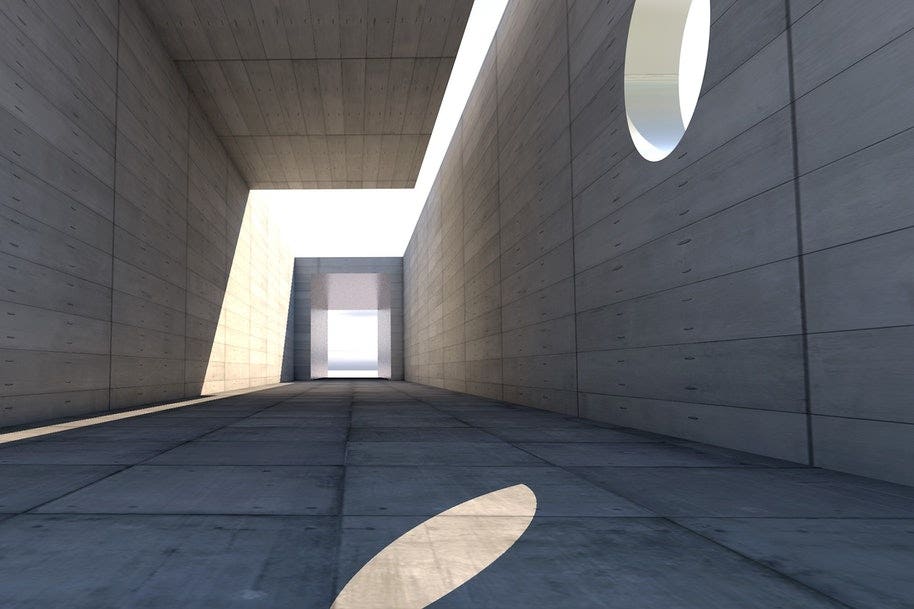 A hallway with light streaming in from the windows. 