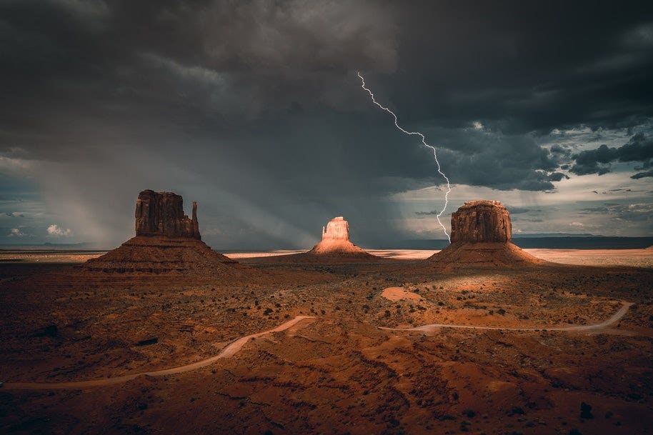 American desert landscape with lightening shot in the background